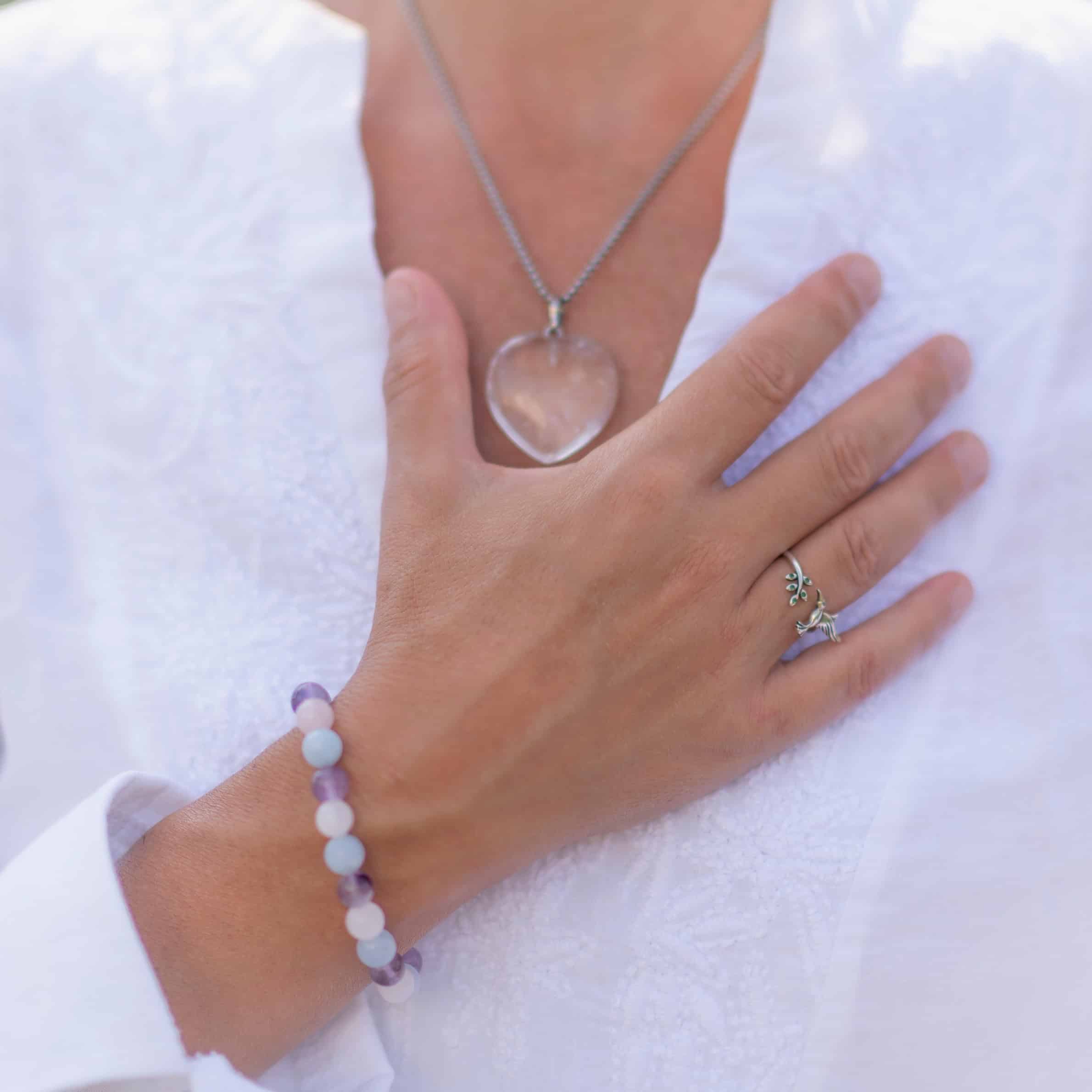 A lady with her hand on her heart