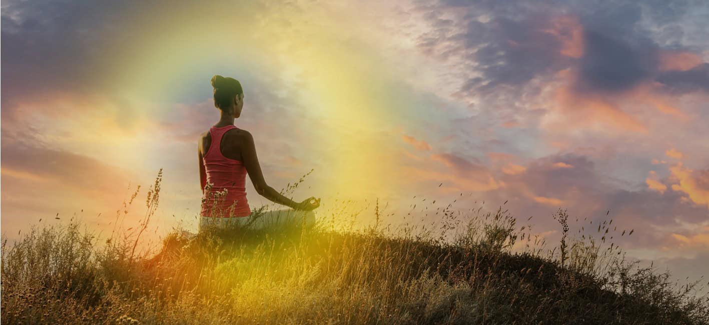 Woman Meditating on Hill near Sea, Back View. Space for Text